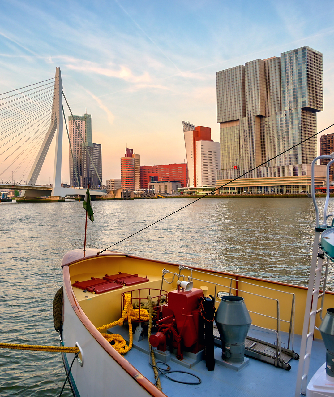 Rotterdam’s striking Erasmus Bridge and skyline showcasing the city’s bold modern design.